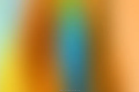 Unscharfer Farbverlauf mit vertikalen Streifen in Orange, Gelb, Blau und Türkis, in der Mitte ein blaugrüner Bereich.