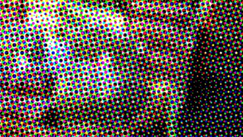 Bunte Rasterpunkte in Rot, Grün, Blau, Gelb und Magenta, die oben links heller und rechts in Schwarz übergehen.