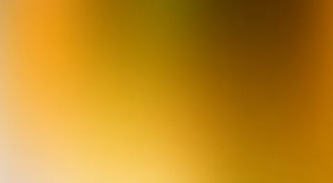 Weicher, unscharfer Farbverlauf von Orange über Gelb bis zu dunklem Braun, links unten fast hell cremefarben.