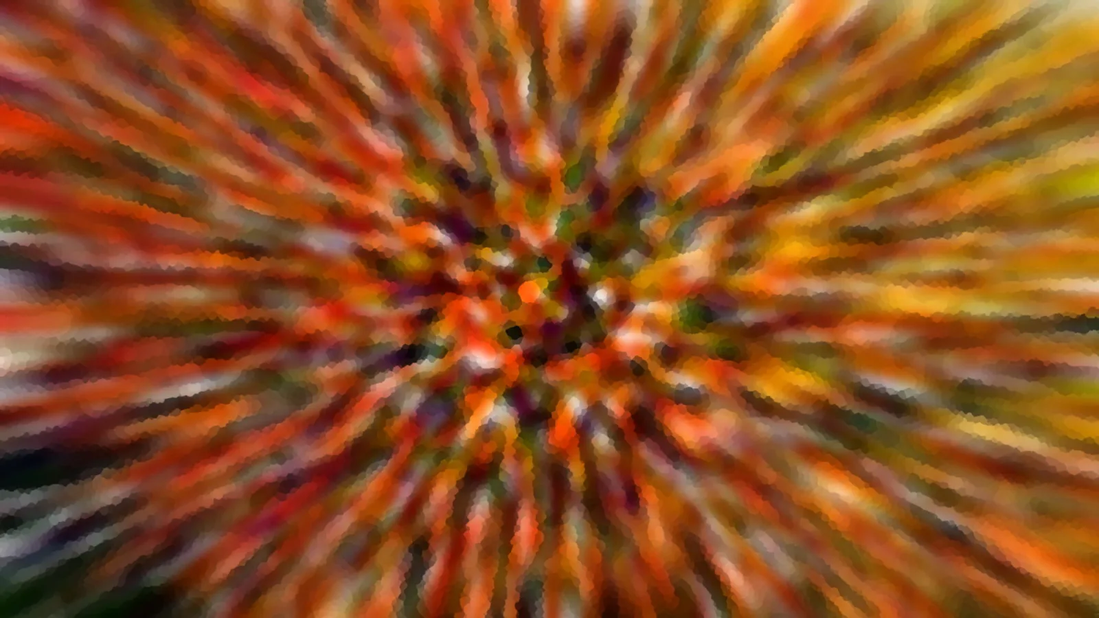 Abstrakte Komposition aus orangefarbenen, roten und gelben Streifen, die von einem dunkleren Zentrum radial nach außen verlaufen, verwischt wie bei einer Zoomaufnahme.