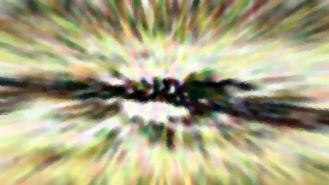 Farbige radiale Bewegungsunschärfe mit einem dunklen horizontalen Streifen in der Bildmitte.