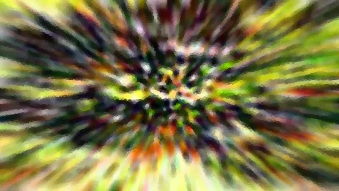Abstrakte Komposition aus grünen, gelben, orangen und dunkelvioletten Farbstrahlen, die radial von einem hellen Zentrum nach außen verlaufen und pixelig verwischt wirken.
