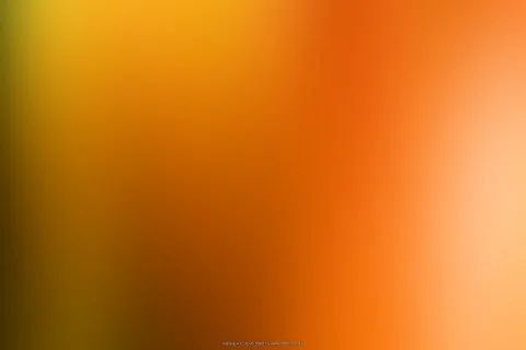 Unscharfer Farbverlauf von Gelb über Orange bis Hellbeige, von links dunkel bis rechts hell.