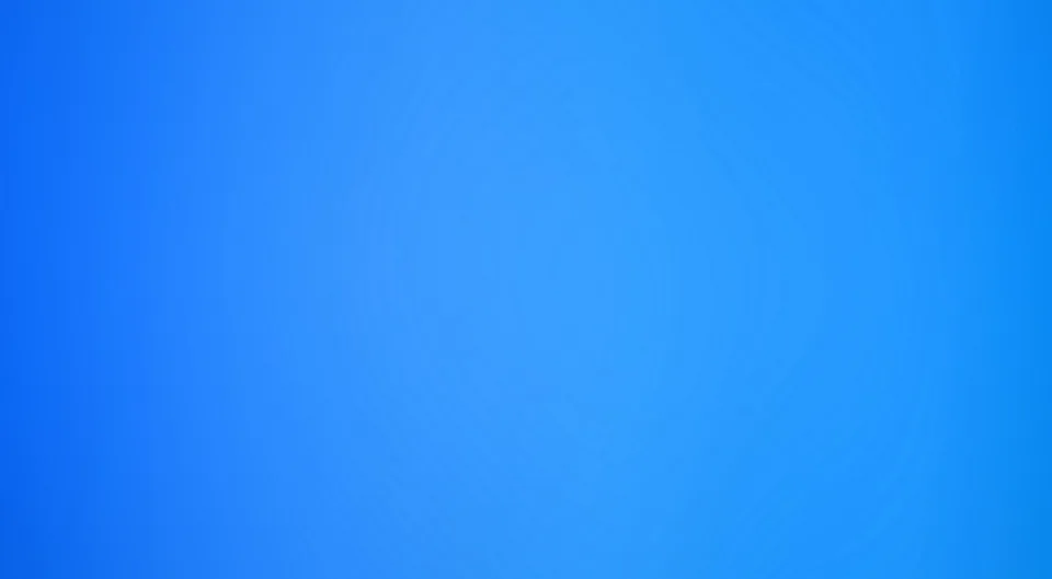 Gleichmäßiger blauer Farbverlauf, in der Mitte heller und zu den Rändern etwas dunkler, mit sanften kreisförmigen Schattierungen.