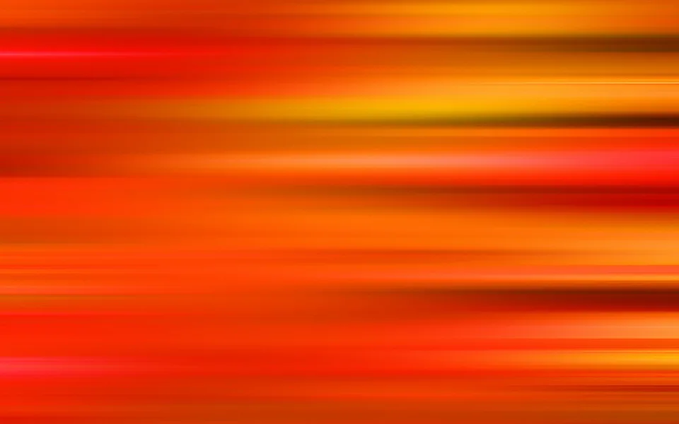 Horizontal verwischte Streifen in Orange, Rot und Gelb, die wie Bewegungsspuren von links nach rechts verlaufen.