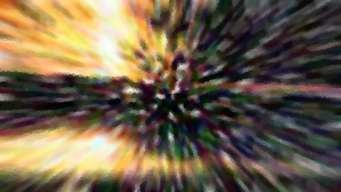 Abstraktes Bild mit radialem Bewegungsunschärfe-Effekt: Farbstreifen laufen von einem dunklen Zentrum nach außen, gelbe und orangefarbene Töne oben links, dunkle Grün- und Violetttöne in der Mitte.