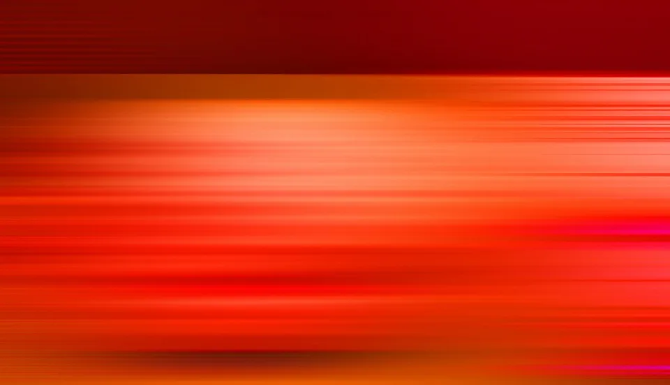 Abstrakte Bewegungsunschärfe aus horizontalen roten und orangefarbenen Streifen, oben dunkler, in der Mitte helles Orange.