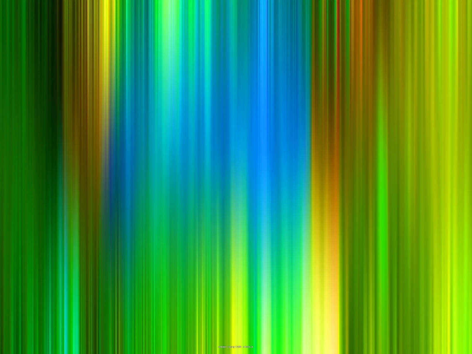 Abstraktes Muster aus vertikalen, weichen Streifen in Grün, Blau, Gelb und Orange, die nebeneinander verlaufen und unscharf ineinander übergehen.