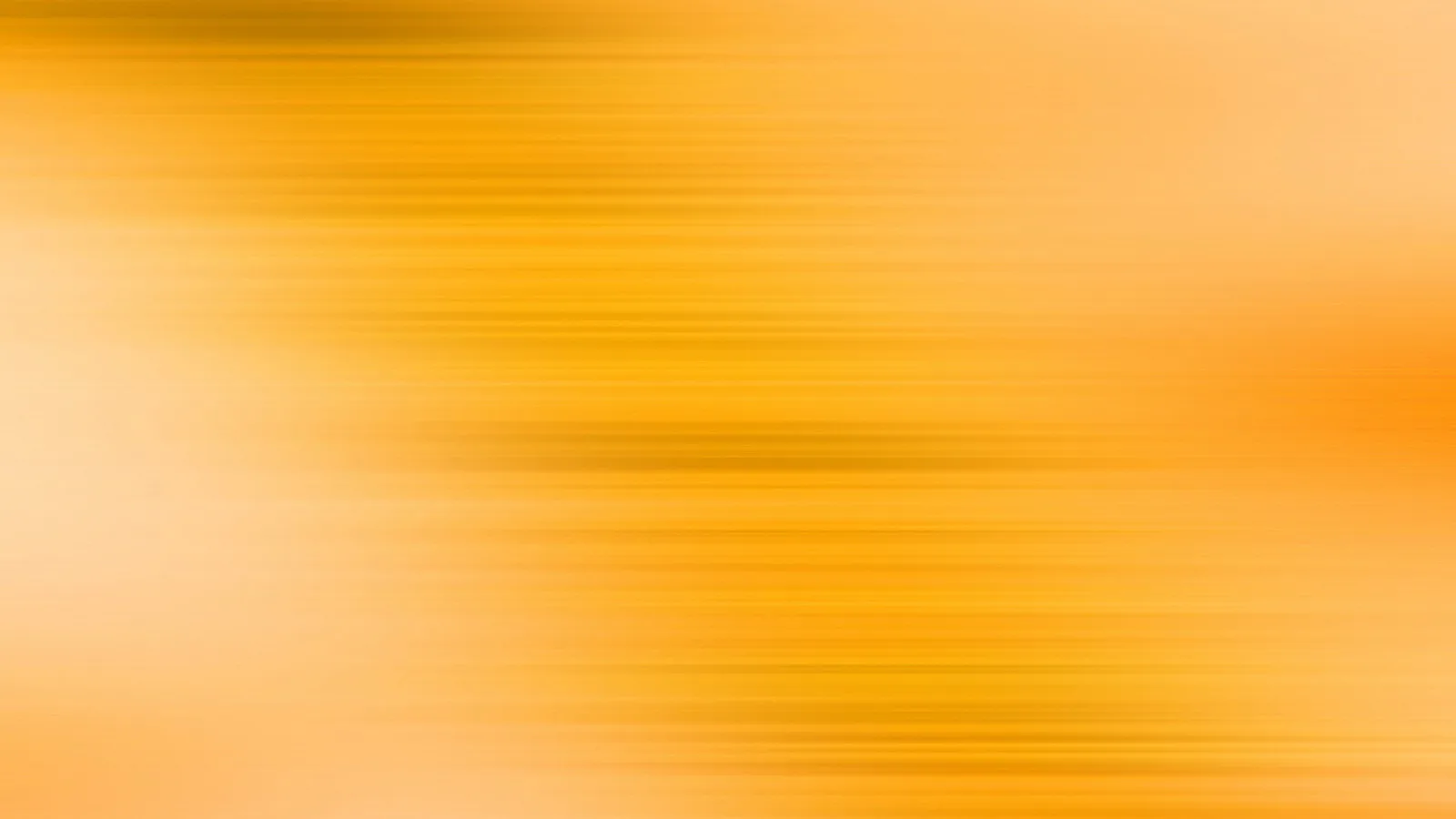 Horizontale, verwischte Streifen in Gelb und Orange, die von hellen Flächen am linken Rand zu kräftigerem Orange rechts übergehen.