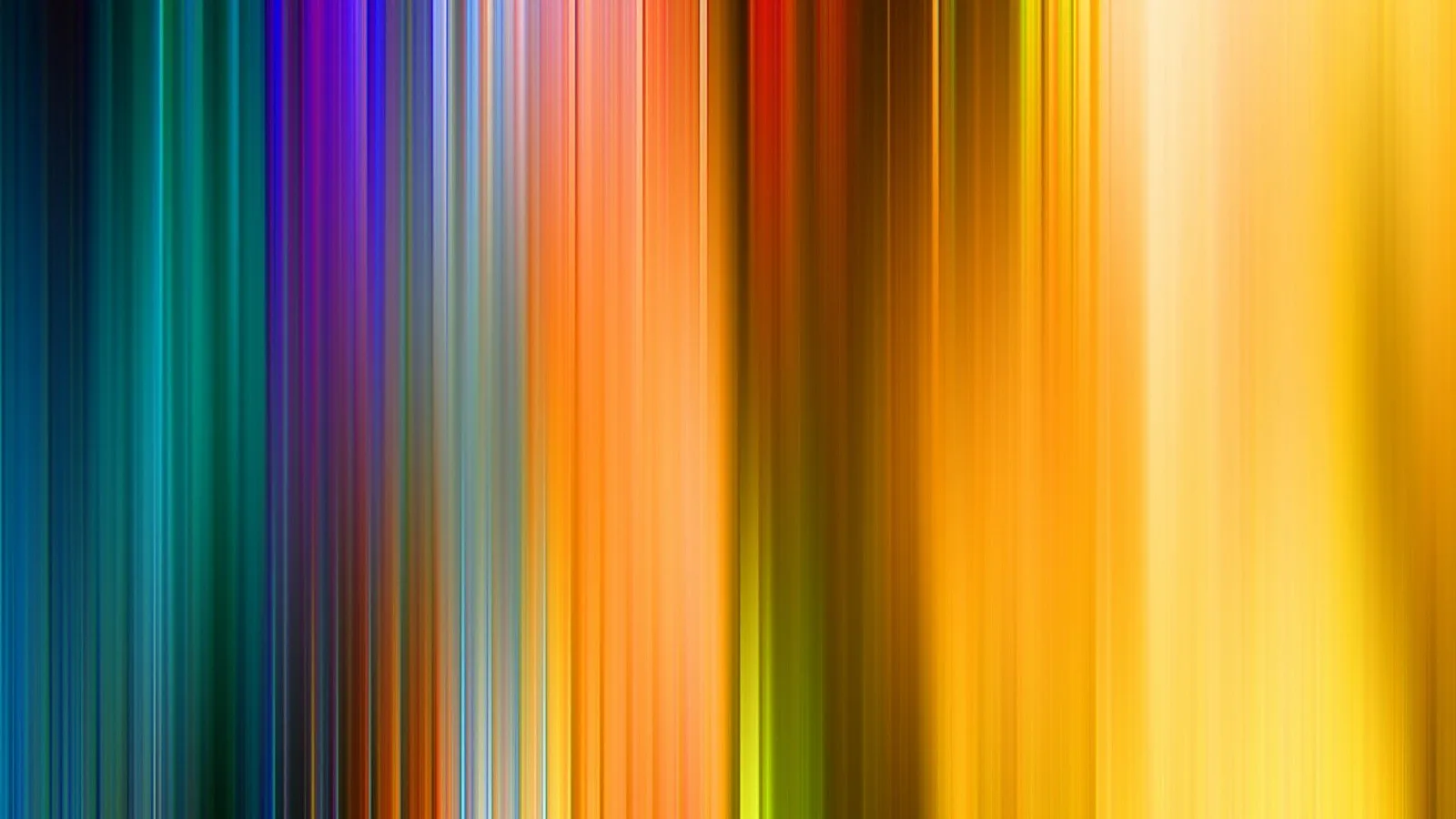 Vertikale, verwischte Lichtstreifen in Blau, Violett, Orange, Rot und Gelb, die von links nach rechts ineinander übergehen.