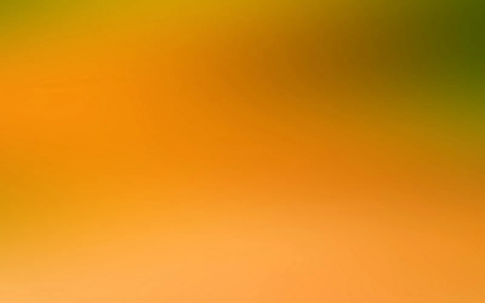 Unscharfer Farbverlauf von Orange über Gelb bis Olivgrün, oben rechts dunkler werdend