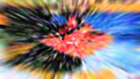 Abstraktes Bild mit radialem Zoomeffekt: im Zentrum rote und orangefarbene Flächen, nach außen blaue, grüne und gelbe Strahlen