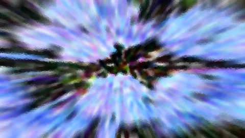 Abstrakte Aufnahme mit radialer Bewegungsunschärfe: Blaue, violette und grüne Streifen strahlen von einem dunklen, grünlichen Zentrum nach außen.