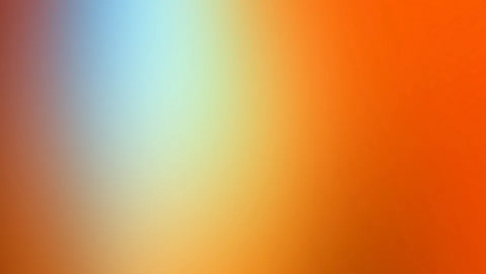 Unscharfer Farbverlauf von Hellblau und Mintgrün über Gelb bis zu kräftigem Orange, Übergänge von links nach rechts.