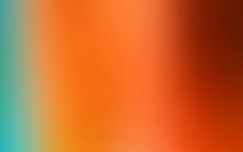 Unscharfer Farbverlauf von Türkis am linken Rand über Orange bis zu dunklem Braunrot am rechten Rand.