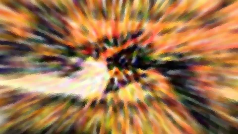 Abstrakte Komposition aus radial angeordneten Farbstreifen in Orange, Gelb, Grün und Violett, die von einem dunklen Zentrum nach außen strahlen.