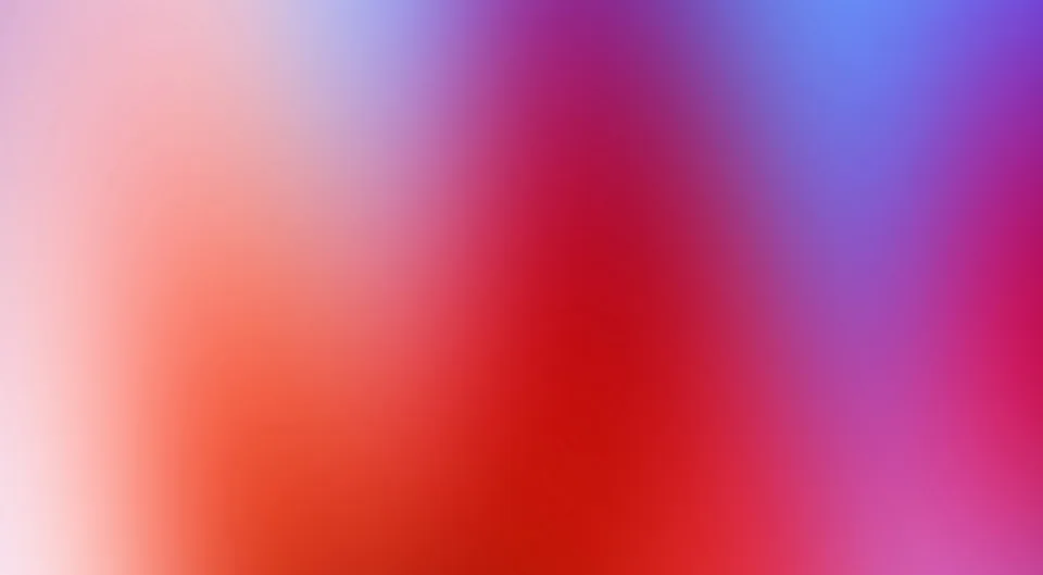 Unscharfer Farbverlauf mit warmem Rot und Orange links und unten, Magenta in der Mitte und Blau oben rechts.
