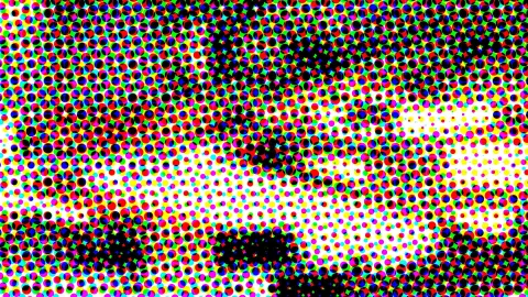 Dichtes Raster aus bunten Punkten in Rot, Grün, Blau, Gelb, Magenta und Cyan, mit großen schwarzen Flecken, vor allem oben und unten, und einem hellen weißen Streifen in der Mitte rechts.