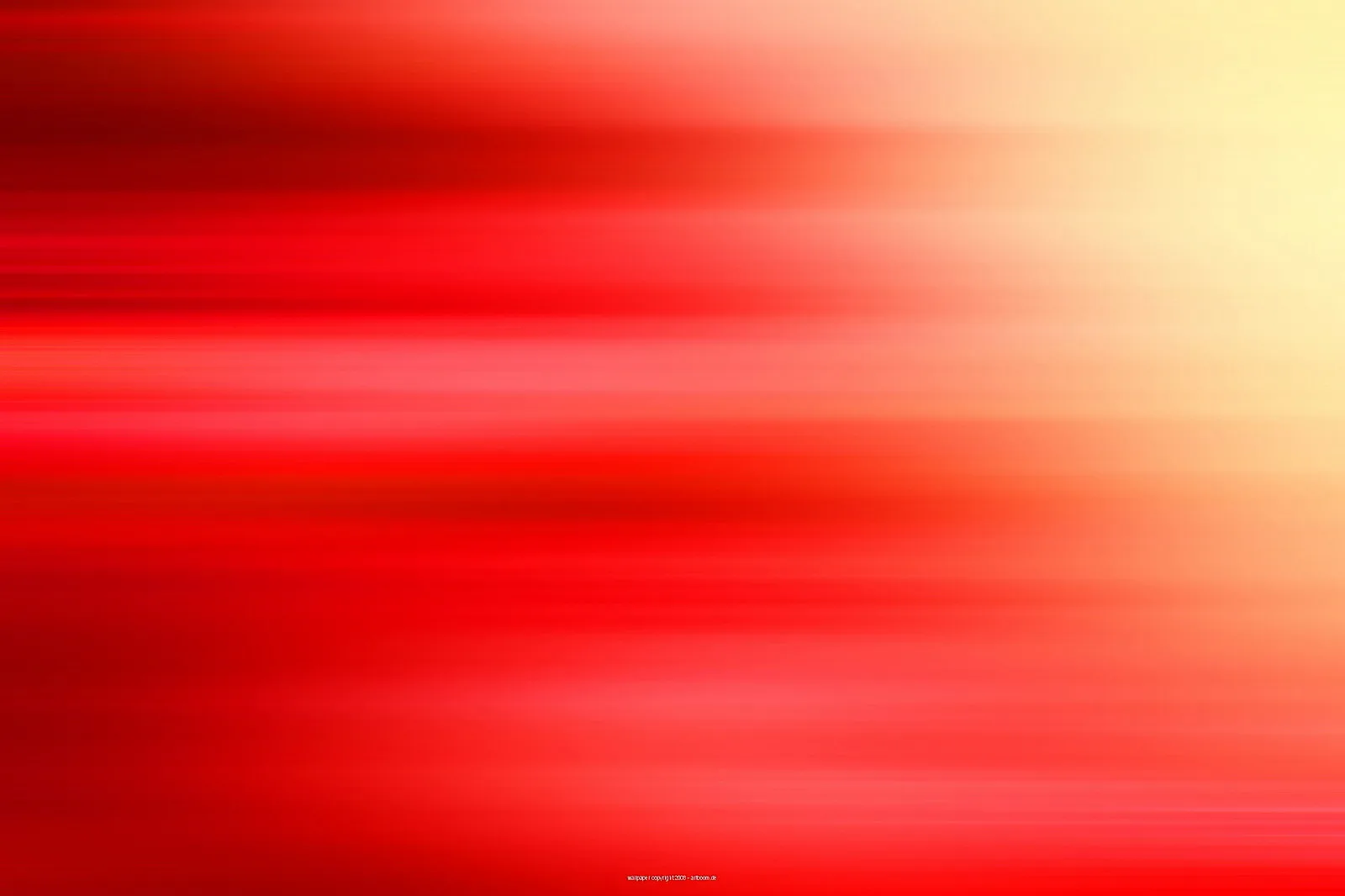 Horizontal verwischte rote Streifen, die von links nach rechts in helles Gelb übergehen, oben rechts am hellsten.