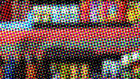 Abstraktes Raster aus dicht gesetzten bunten Punkten in Rot, Gelb, Blau, Grün und Magenta, dazwischen schwarze Flächen.