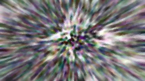 Abstraktes Bild mit farbigen Strahlen, die von einem dunklen Zentrum nach außen laufen, im Stil eines Zoomeffekts mit Bewegungsunschärfe und mosaikartiger Körnung.