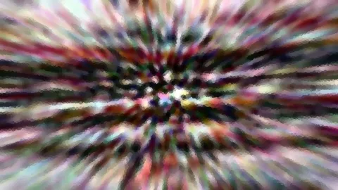 Abstraktes Bild mit farbigen Streifen, die von einem hellen Zentrum radial nach außen verlaufen und pixelig wirken.