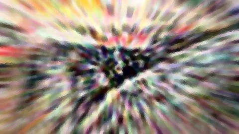 Abstraktes Bild mit bunten, radial von einem dunklen Zentrum nach außen verlaufenden Streifen in Gelb, Rot, Grün und Violett, leicht verpixelt.