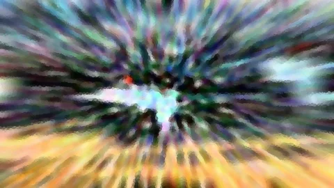 Abstrakte Komposition aus radialer Bewegungsunschärfe mit bunten Streifen in Blau, Grün und Violett, einem hellen Zentrum und gelb-orangefarbenen Strahlen im unteren Bereich.