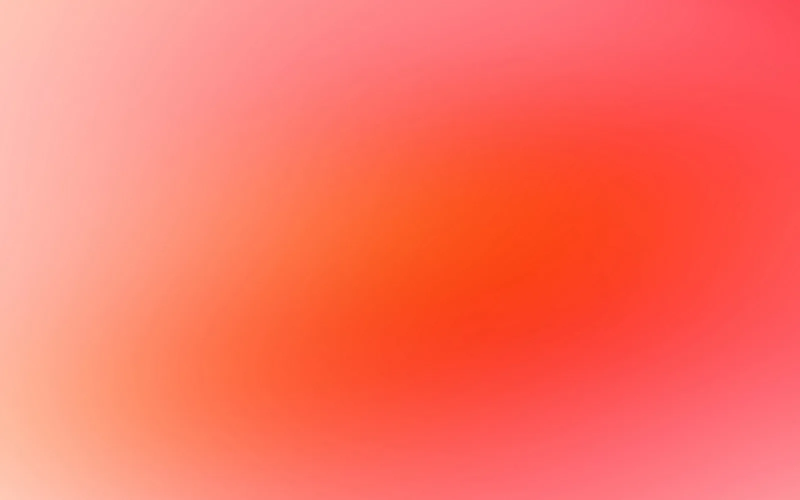 Unscharfer Farbverlauf von hellem Rosa an den Rändern zu kräftigem Orangerot in der Bildmitte