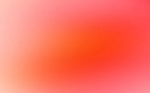 Unscharfer Farbverlauf von hellem Rosa an den Rändern zu kräftigem Orangerot in der Bildmitte