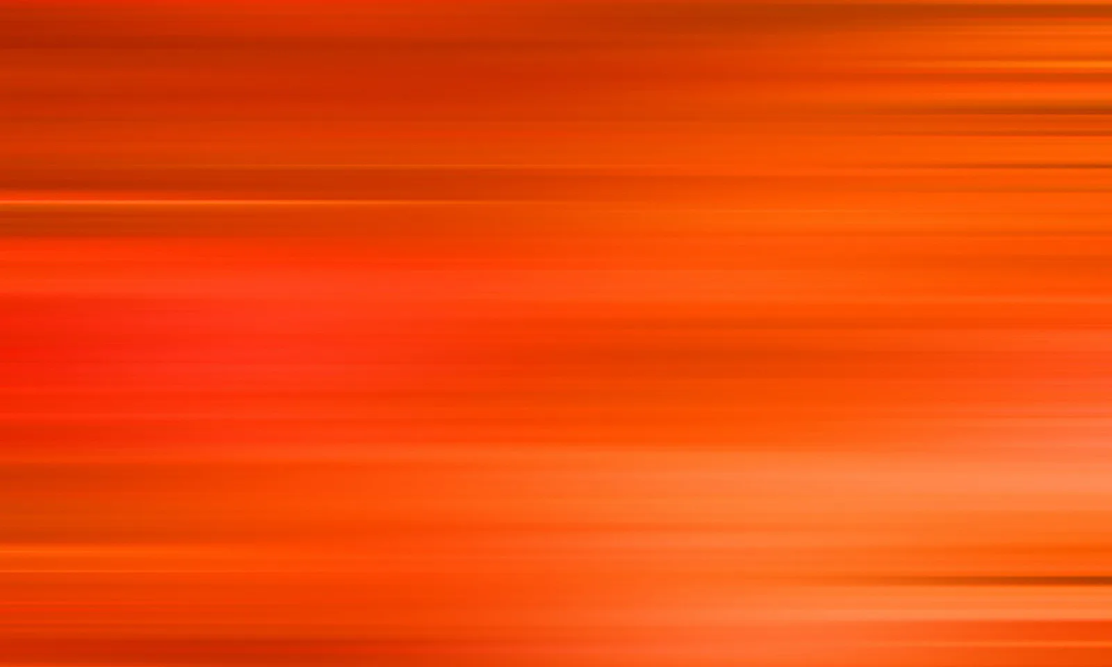 Verschwommene horizontale Streifen in Orange und Rot, heller zur rechten unteren Seite hin.
