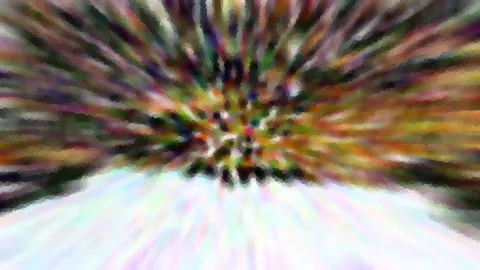 Abstrakte Aufnahme mit radial von der Mitte nach außen laufenden, bunten Unschärfestreifen in Grün, Rot, Orange und Violett. Unten geht das Bild in helle, pastellfarbene Schlieren über.