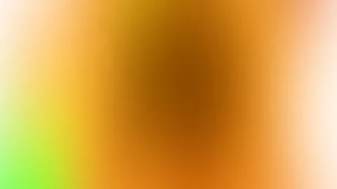 Unscharfer Farbverlauf mit einem dunkelbraunen Zentrum, das in Orange, Gelb und Grün übergeht, an den Rändern hell cremefarben.