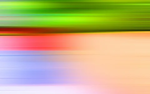 Horizontal verwischte Farbstreifen: oben grün, darunter rot, dann Orange, unten Blau und Lila, alles in Bewegungsunschärfe.