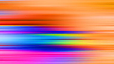 Abstraktes Bild aus horizontalen, verwischten Streifen in Orange, Rot, Blau, Grün, Gelb und Magenta, das wie eine schnelle Bewegungsunschärfe wirkt.