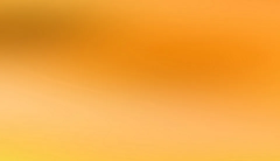 Weicher Farbverlauf in Orange und Gelb, dunklere Orangetöne oben links, helleres Gelb am unteren Rand.