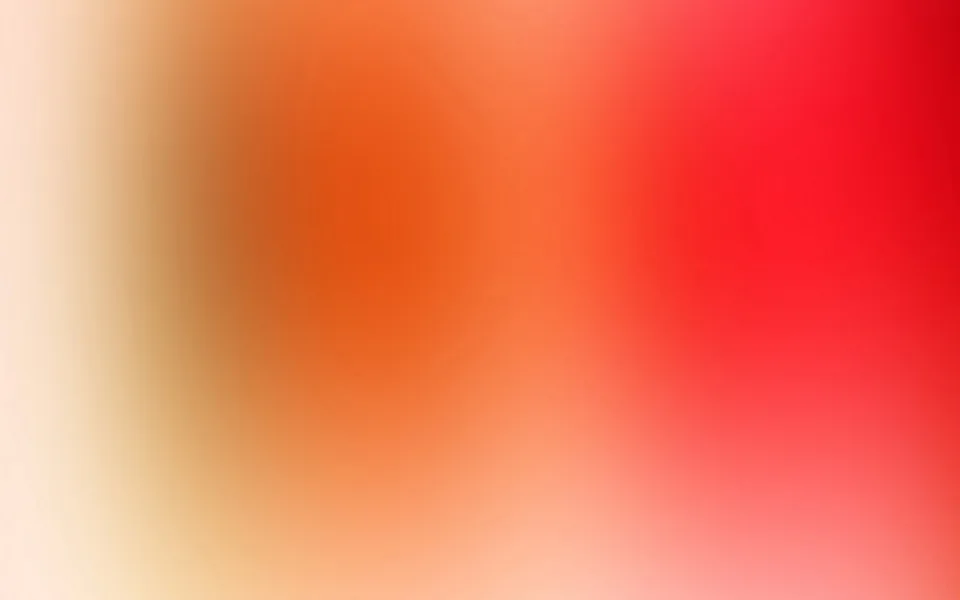 Unscharfer Farbverlauf von cremefarbenem Weiß links über Orange in der Mitte bis zu kräftigem Rot rechts