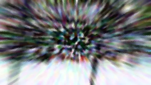 Abstraktes Bild mit unscharfen Farbstreifen, die von einer dunklen Mitte radial nach außen laufen, in Grün, Violett und Weiß.