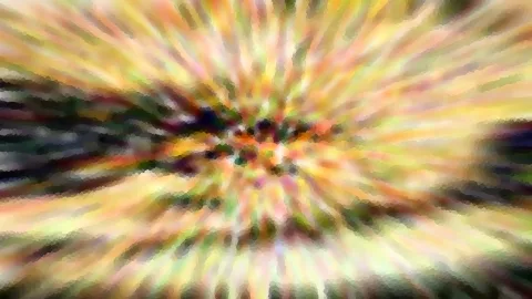 Abstrakte, mosaikartig verpixelte Unschärfe mit radial von der Mitte ausstrahlenden Streifen in Gelb, Grün und Dunkelbraun.