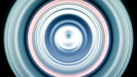 Konzentrische, weiß leuchtende und blau-rosa getönte Ringe mit radialer Bewegungsunschärfe vor schwarzem Hintergrund, im Zentrum ein heller Punkt.