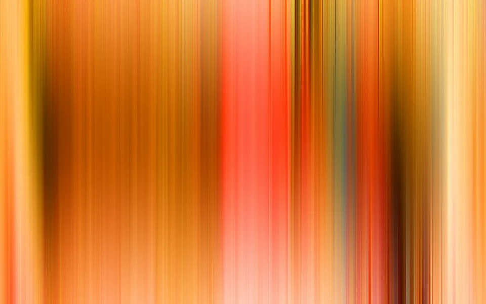 Abstrakte, vertikal verwischte Streifen in Orange, Gelb, Rot und Braun, die von hell nach dunkel wechseln.