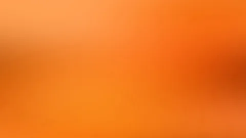 Unscharfer Farbverlauf in Orange, heller oben links und dunkler rötlich rechts, ohne erkennbare Motive.