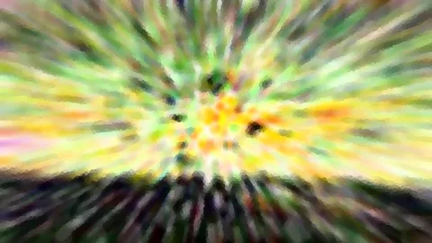 Radial verwischte Farbexplosion in Gelb, Grün und Orange mit dunklen Schlieren am unteren Rand