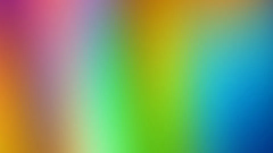 Unscharfer Farbverlauf von Magenta links oben über Orange und Grün bis Blau rechts unten, ohne erkennbare Motive.