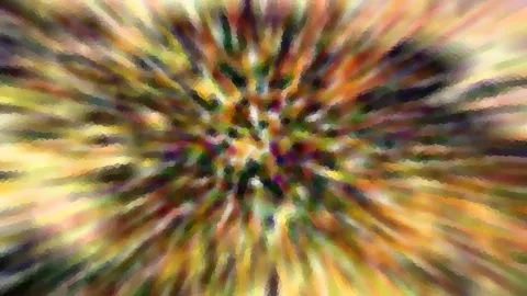 Abstraktes Bild mit radial von einem Zentrum nach außen verlaufenden Streifen in Gelb, Orange, Grün und Violett, mosaikartig gepixelt.