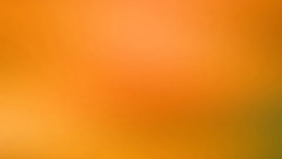 Unscharfer Farbverlauf von Orange über Gelb bis zu einem dunklen Olivgrün in der rechten unteren Ecke.