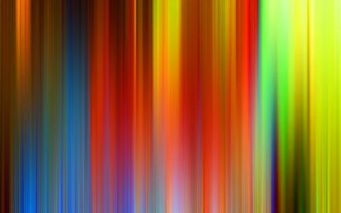 Vertikale, verwischte Streifen in Blau, Rot, Orange, Gelb und Grün nebeneinander.