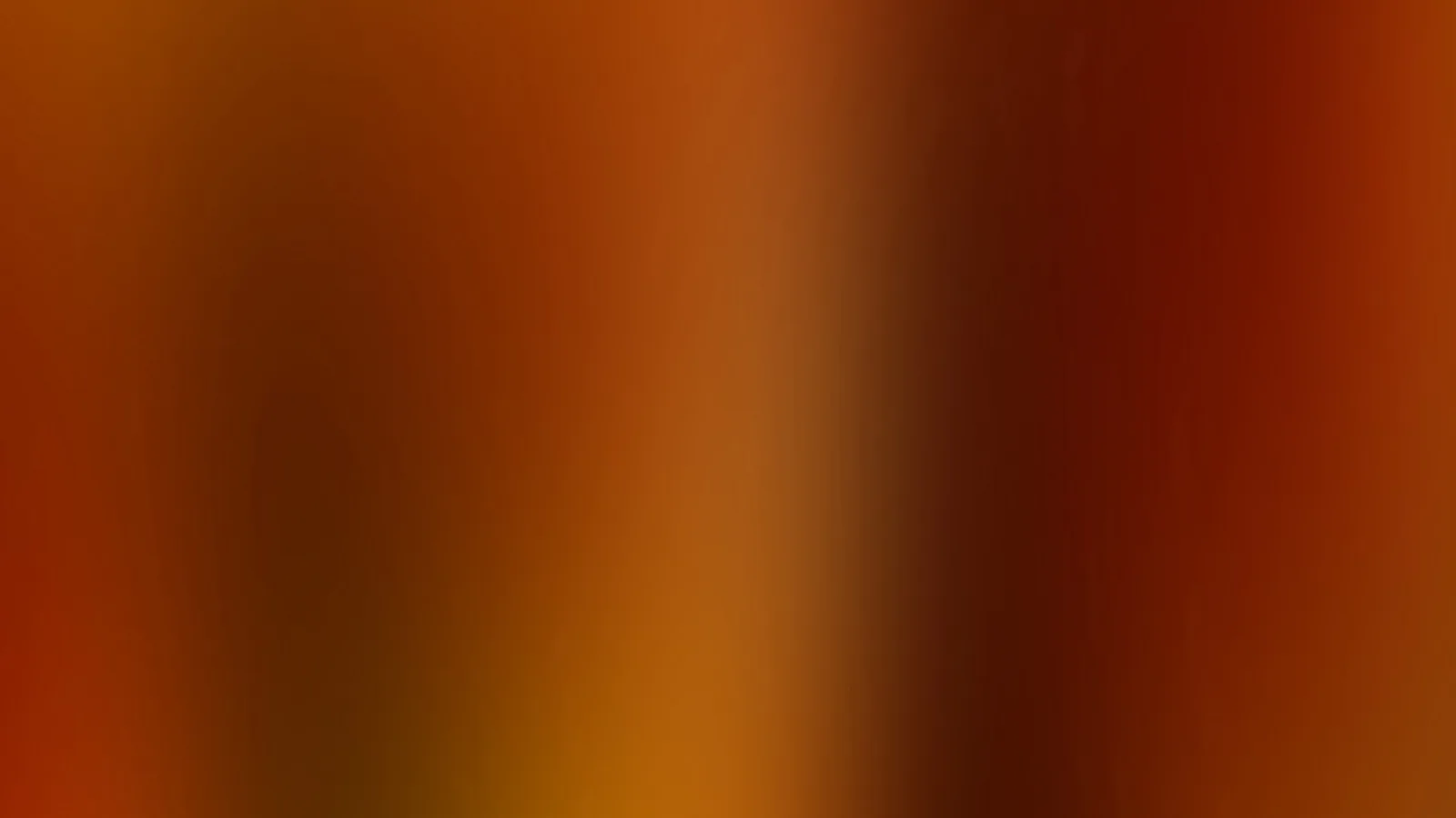 Weicher Farbverlauf in Orange, Braun und Rostrot mit dunkleren Bereichen rechts und einem helleren Streifen in der Mitte.