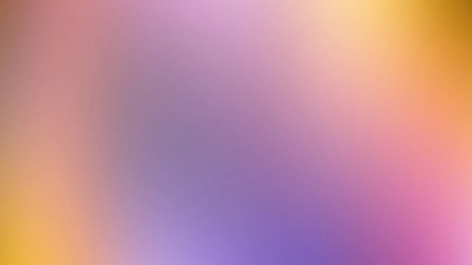 Unscharfer Farbverlauf von Lila über Rosa bis Orange und Gelb, diagonal von unten links nach oben rechts