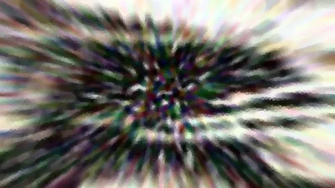 Abstraktes Bild mit radialem Zoomeffekt: bunte, dunkelgrüne und weiße Schlieren strahlen von einem dunklen Zentrum nach außen, die Ränder sind hell und verwischt.